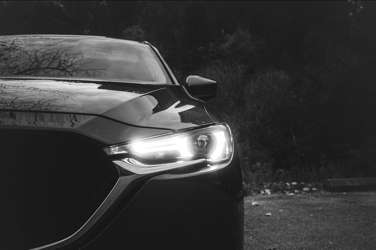 Car after a Blackout detail, deep glossy black finish