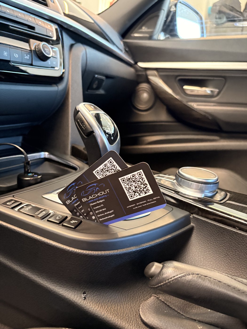 Spotless BMW interior with Blackout detailing business cards