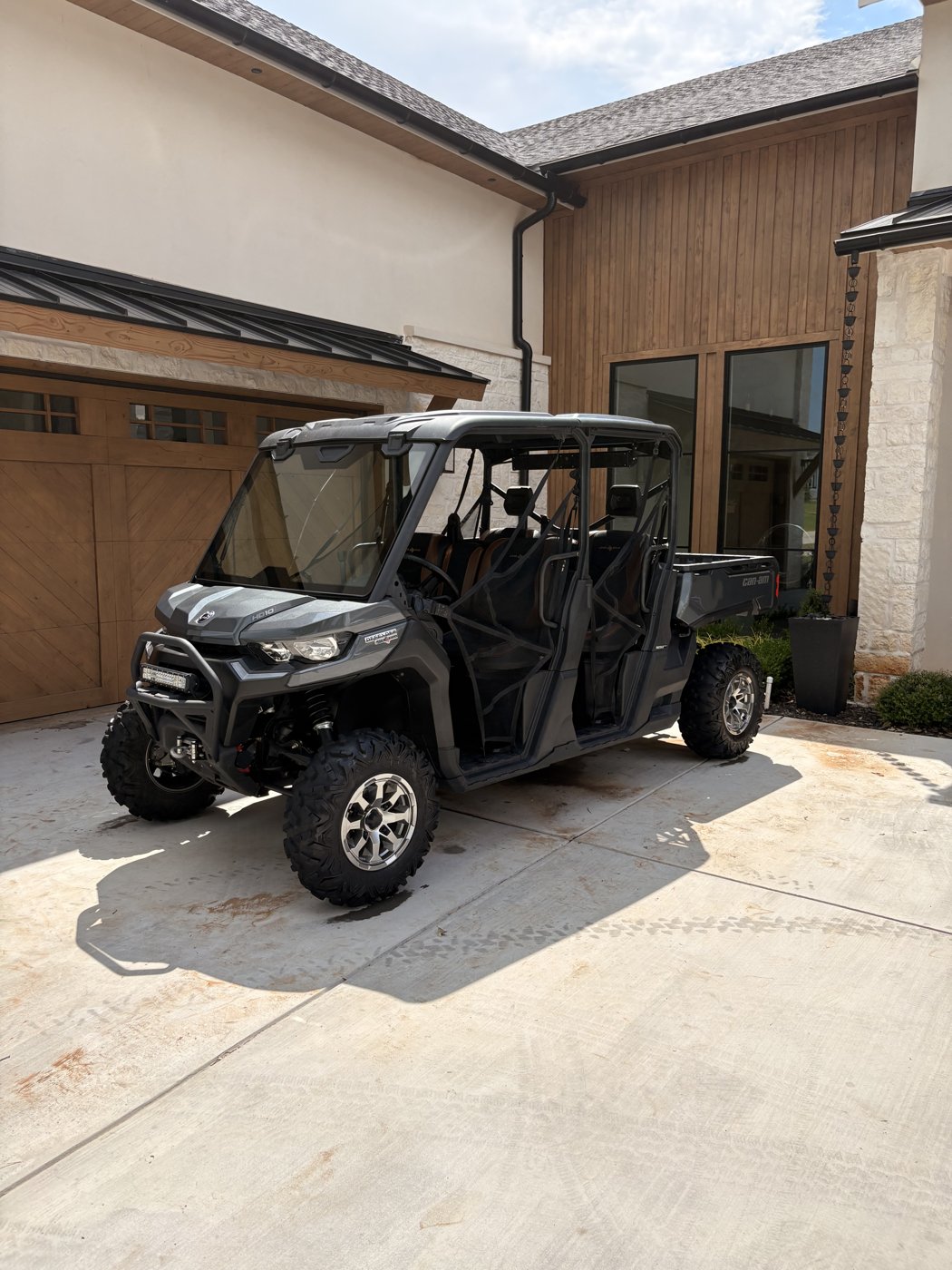 Cleaned side by side UTV parked in front of a house